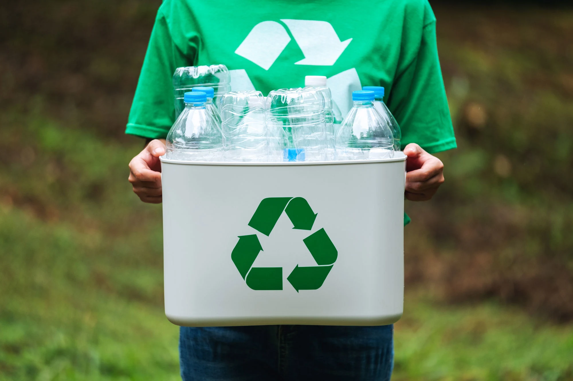 a-woman-holding-a-recycle-bin-with-plastic-bottles-2024-11-27-03-19-50-utc2-1.webp